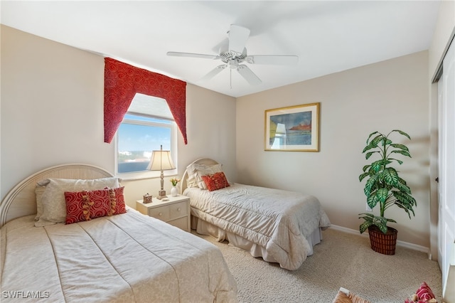 6361 Pelican Bay Blvd Unit 605, Naples, FL 34108 - bedroom with a closet, baseboards, a ceiling fan, and carpet floors