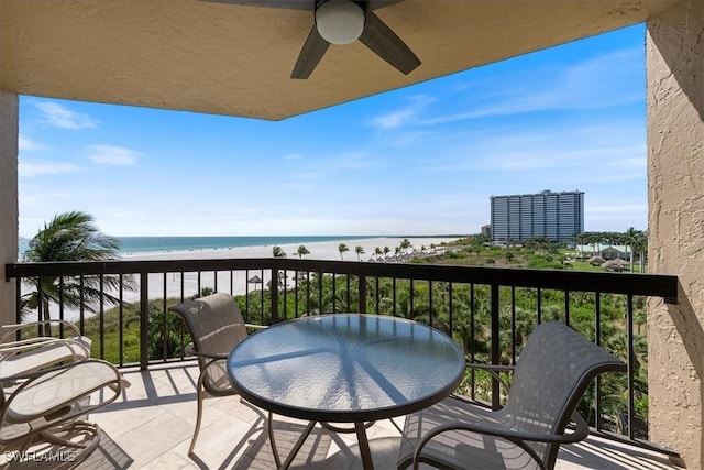 174 S Collier Blvd Unit 504, Marco Island, FL 34145 - balcony featuring ceiling fan and view of water and beach