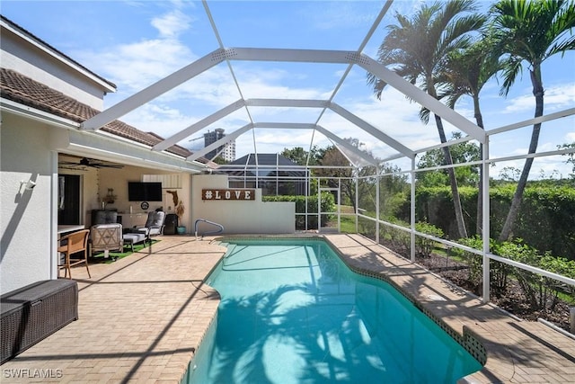pool with a patio, an outdoor living space, a lanai, and a ceiling fan