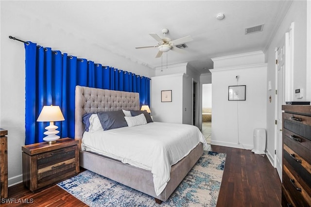 bedroom featuring visible vents, baseboards, and wood-type flooring