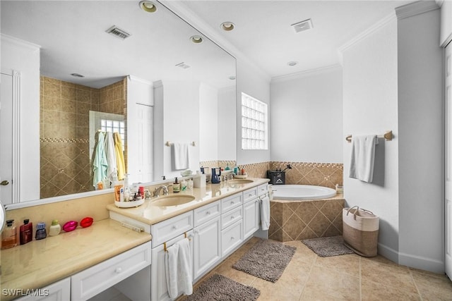 full bathroom featuring visible vents, a sink, crown molding, tile patterned flooring, and a garden tub