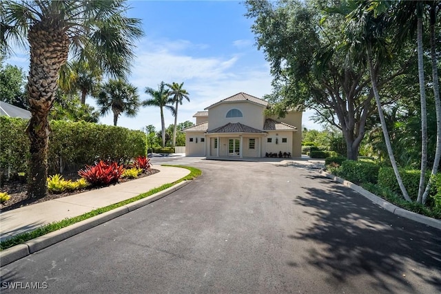 view of front of house featuring driveway and stucco siding