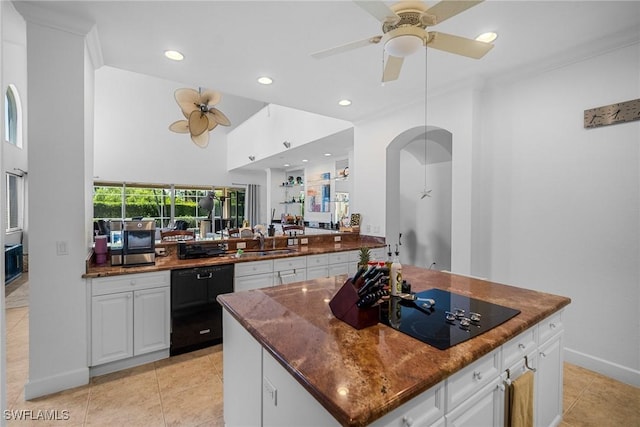 kitchen featuring a center island, a sink, a ceiling fan, black appliances, and recessed lighting