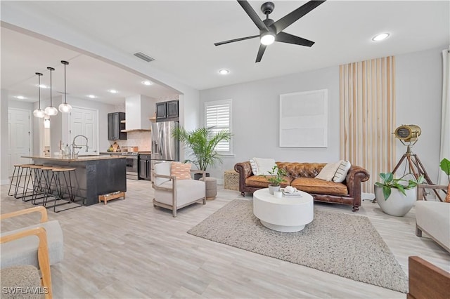 3544 Brittons Ct, Fort Myers, FL 33916 - living room with light wood-style floors, visible vents, a ceiling fan, and recessed lighting
