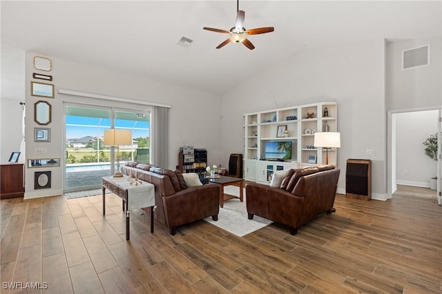 14190 Binghampton Dr, Fort Myers, FL 33905 - living room featuring high vaulted ceiling, wood finished floors, and ceiling fan