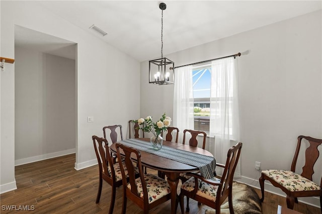 14190 Binghampton Dr, Fort Myers, FL 33905 - dining room featuring dark wood-style flooring and a chandelier