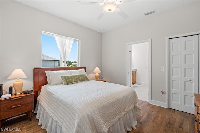 14190 Binghampton Dr, Fort Myers, FL 33905 - bedroom featuring wood finished floors, connected bathroom, a ceiling fan, and a closet