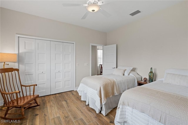 14190 Binghampton Dr, Fort Myers, FL 33905 - bedroom with a closet, wood finished floors, and ceiling fan