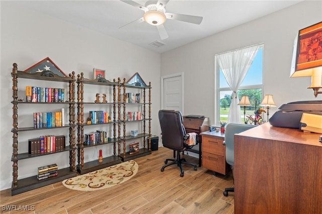 14190 Binghampton Dr, Fort Myers, FL 33905 - office area with light wood-style flooring and a ceiling fan