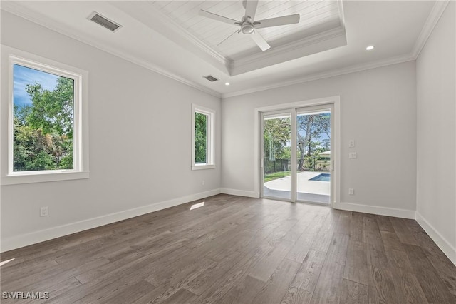 1136 Trail Terrace Dr, Naples, FL 34103 - spare room with a tray ceiling, visible vents, crown molding, and dark wood-type flooring