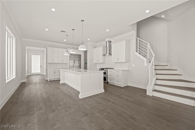 1136 Trail Terrace Dr, Naples, FL 34103 - kitchen with dark wood finished floors, visible vents, wall chimney exhaust hood, and double oven range