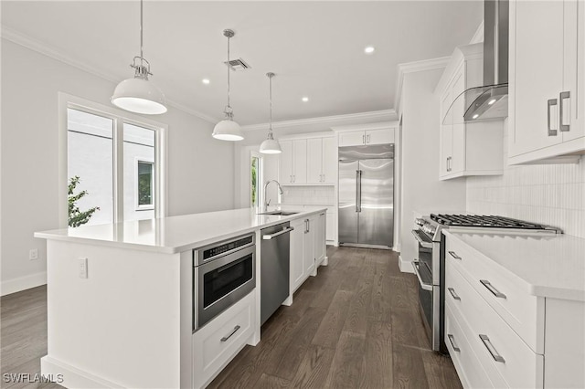 1136 Trail Terrace Dr, Naples, FL 34103 - kitchen with wall chimney range hood, ornamental molding, built in appliances, and visible vents