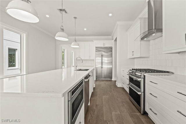 1136 Trail Terrace Dr, Naples, FL 34103 - kitchen with a sink, built in appliances, wall chimney range hood, visible vents, and a kitchen island with sink