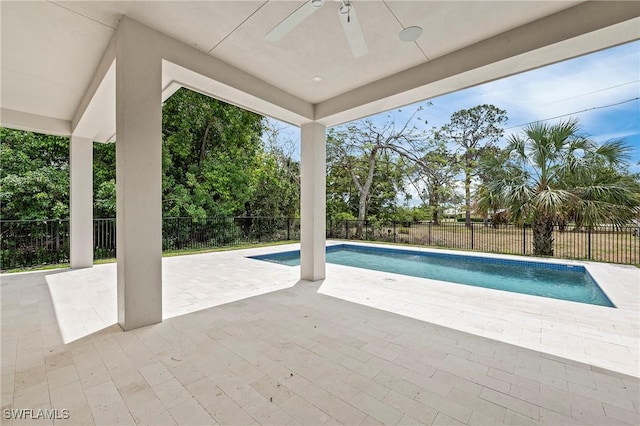 1136 Trail Terrace Dr, Naples, FL 34103 - view of swimming pool with a fenced backyard, a fenced in pool, ceiling fan, and a patio
