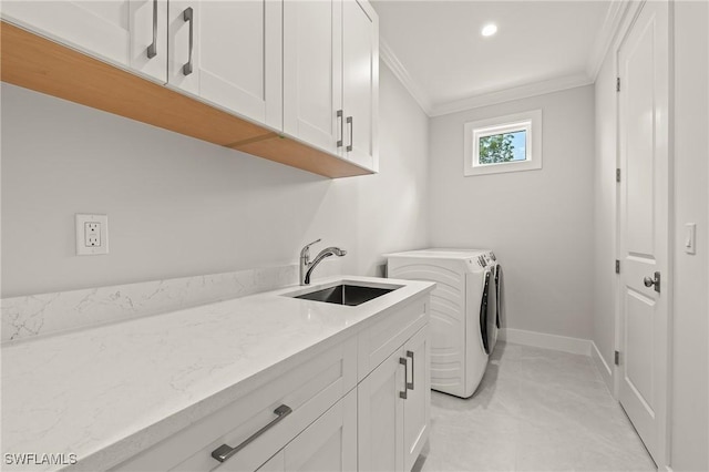 1136 Trail Terrace Dr, Naples, FL 34103 - laundry area with crown molding, a sink, separate washer and dryer, baseboards, and cabinet space