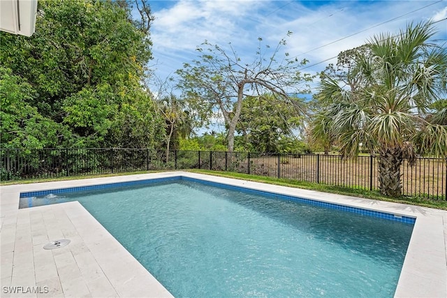 1136 Trail Terrace Dr, Naples, FL 34103 - view of swimming pool with a fenced backyard, a fenced in pool, and a patio
