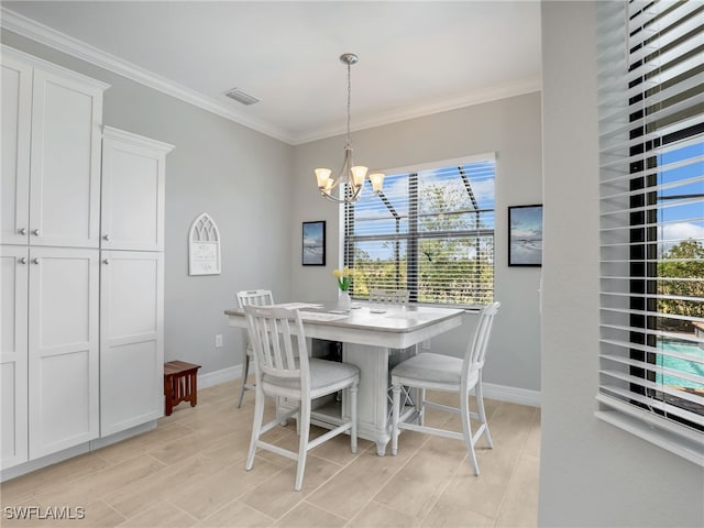 19469 The Place Blvd, Estero, FL 33928 - dining room with a chandelier, baseboards, crown molding, and healthy amount of natural light