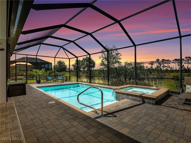 19469 The Place Blvd, Estero, FL 33928 - view of swimming pool featuring a patio area, a pool with connected hot tub, and a lanai