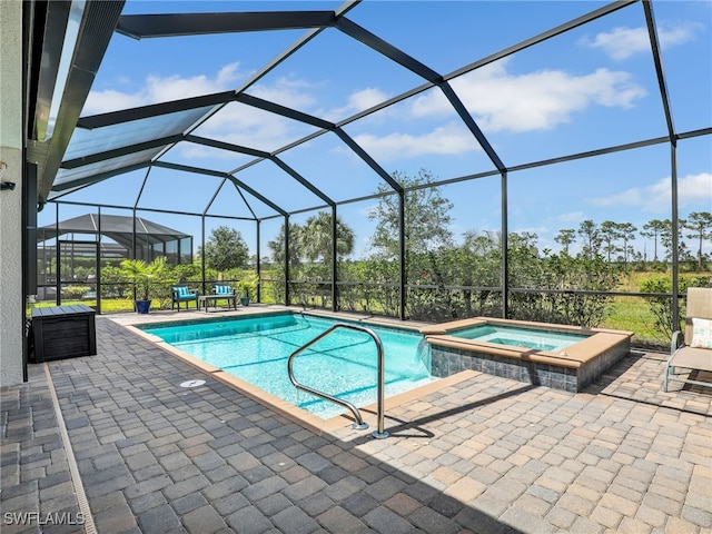 19469 The Place Blvd, Estero, FL 33928 - view of swimming pool featuring a lanai, a patio, and a pool with connected hot tub