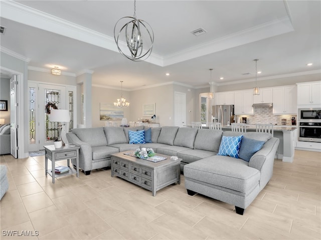 19469 The Place Blvd, Estero, FL 33928 - living room featuring a chandelier, a raised ceiling, recessed lighting, crown molding, and light tile patterned flooring