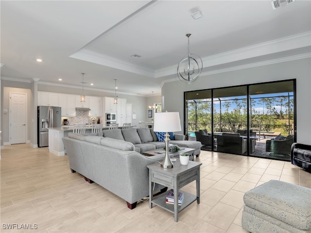 19469 The Place Blvd, Estero, FL 33928 - living area featuring a chandelier, ornamental molding, recessed lighting, and a raised ceiling