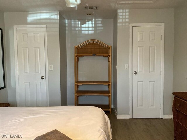 77 Cardinal Dr, North Fort Myers, FL 33917 - bedroom featuring wood finished floors and baseboards