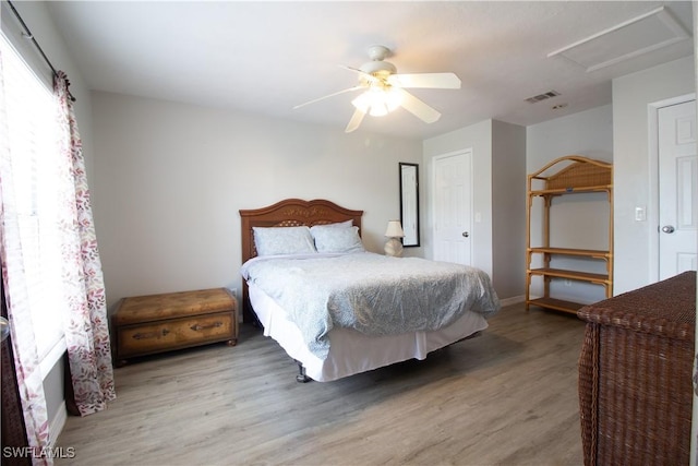 77 Cardinal Dr, North Fort Myers, FL 33917 - bedroom featuring wood finished floors, ceiling fan, and baseboards
