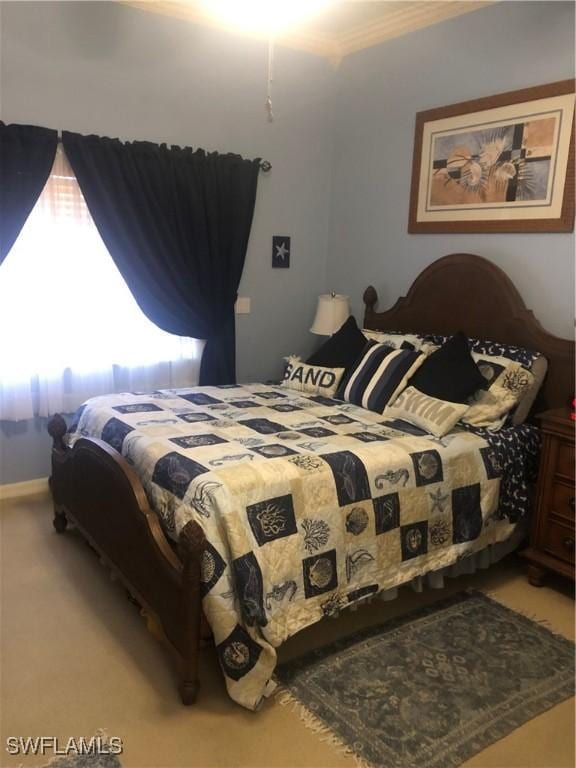 bedroom featuring light carpet and crown molding