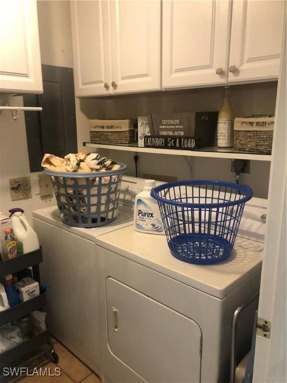 washroom with cabinet space and washer and clothes dryer