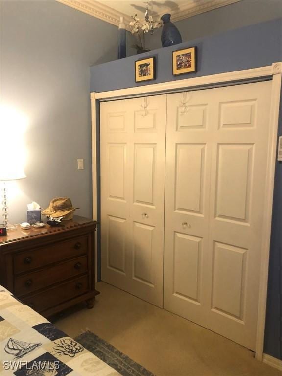bedroom with a closet and an inviting chandelier