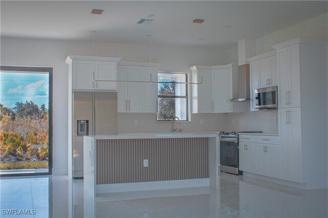 3202 72nd St W, Lehigh Acres, FL 33971 - kitchen featuring stainless steel appliances, white cabinetry, a sink, and light countertops