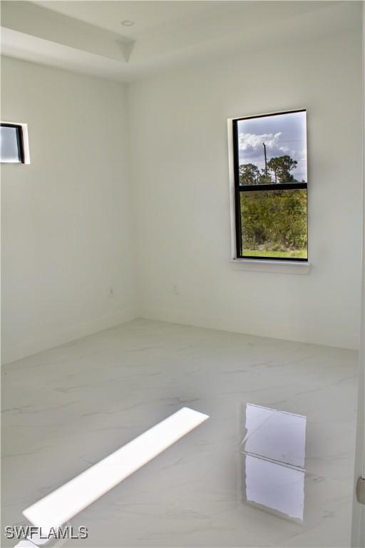3202 72nd St W, Lehigh Acres, FL 33971 - empty room with marble finish floors