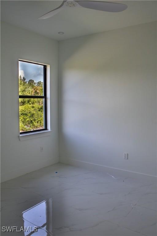 3202 72nd St W, Lehigh Acres, FL 33971 - spare room with baseboards