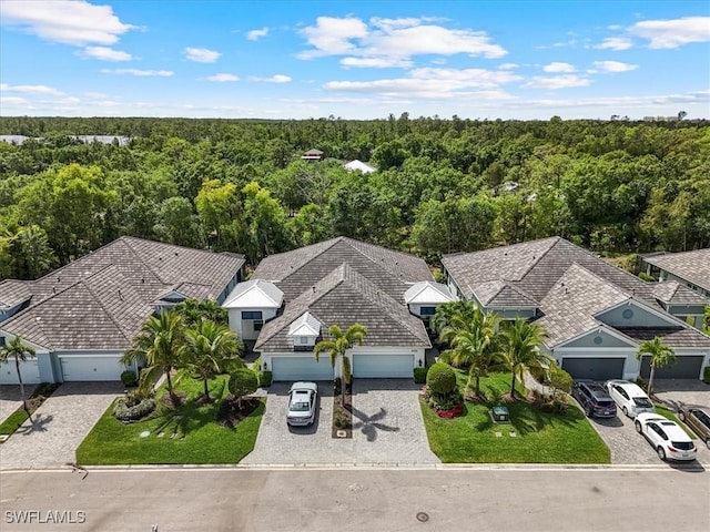 7024 Mistral Way, Fort Myers, FL 33966 - aerial view of property and surrounding area featuring a heavily wooded area