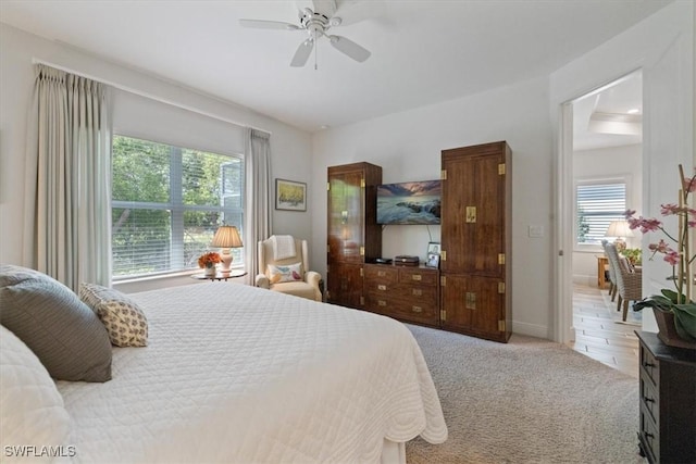 7024 Mistral Way, Fort Myers, FL 33966 - bedroom featuring multiple windows, carpet, and a ceiling fan