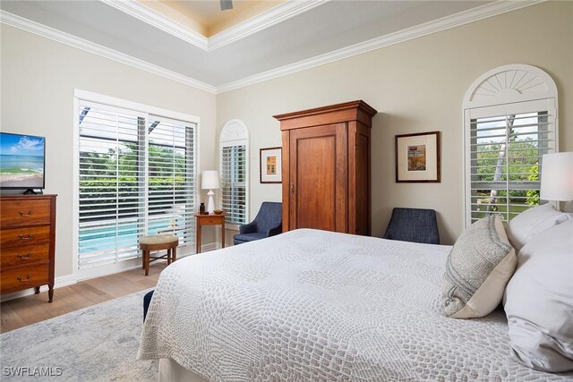 1002 Fountain Run, Naples, FL 34119 - bedroom with light wood finished floors, crown molding, and a ceiling fan