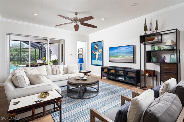 1002 Fountain Run, Naples, FL 34119 - living room featuring a ceiling fan, light wood-style floors, ornamental molding, baseboards, and recessed lighting