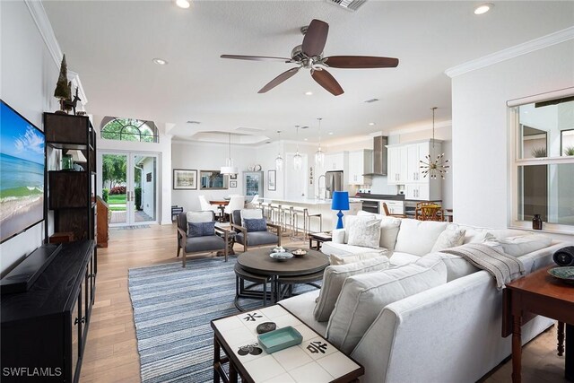 1002 Fountain Run, Naples, FL 34119 - living area featuring ceiling fan, light wood-style floors, ornamental molding, and recessed lighting