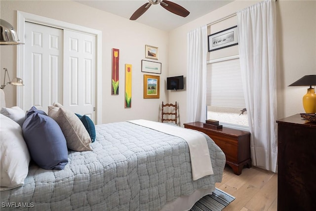 1002 Fountain Run, Naples, FL 34119 - bedroom with light wood-type flooring, a closet, and ceiling fan