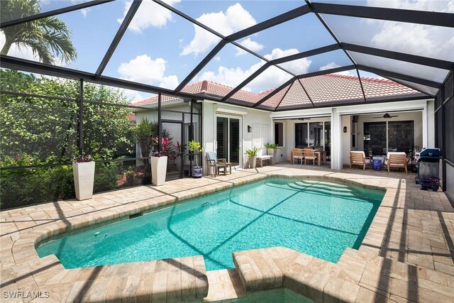 1002 Fountain Run, Naples, FL 34119 - outdoor pool with a patio area, outdoor dining area, ceiling fan, area for grilling, and glass enclosure