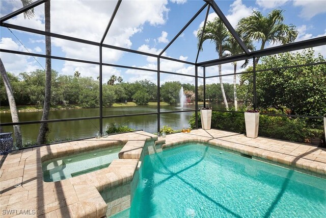 1002 Fountain Run, Naples, FL 34119 - view of swimming pool with a water view, a lanai, view of wooded area, and a pool with connected hot tub