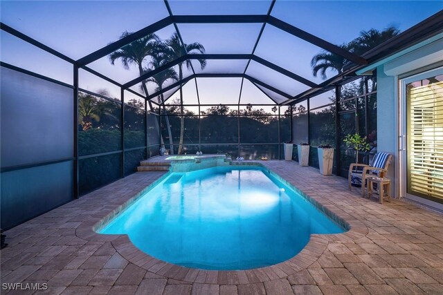 1002 Fountain Run, Naples, FL 34119 - view of swimming pool featuring a patio, a pool with connected hot tub, and glass enclosure