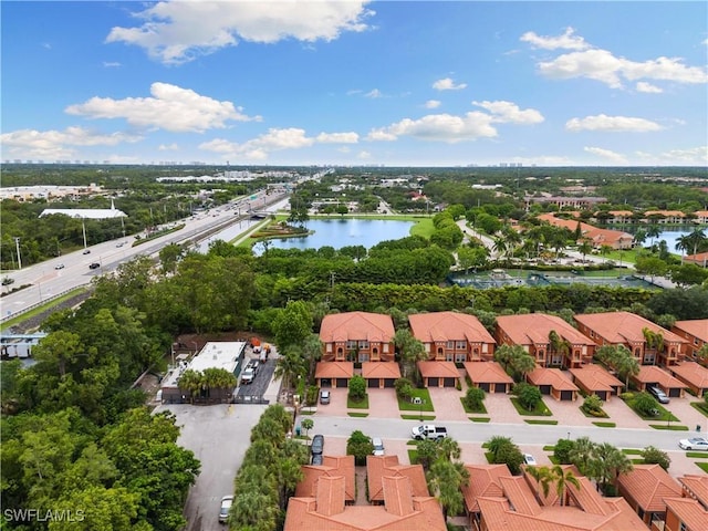 10021 Heather Ln Unit 803, Naples, FL 34119 - drone / aerial view featuring a water view and a residential view
