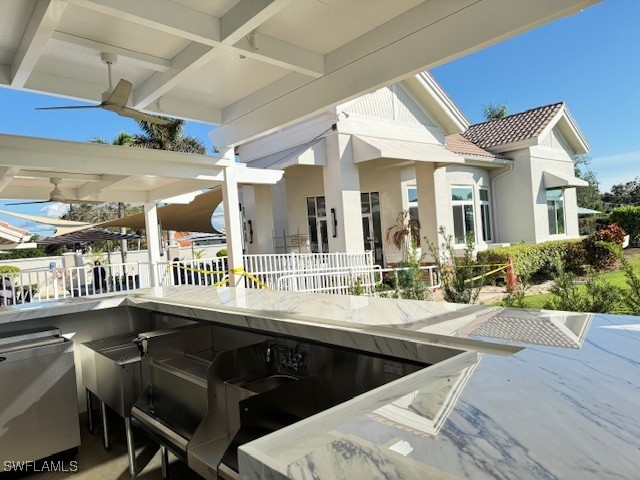 10021 Heather Ln Unit 803, Naples, FL 34119 - view of patio with outdoor dry bar