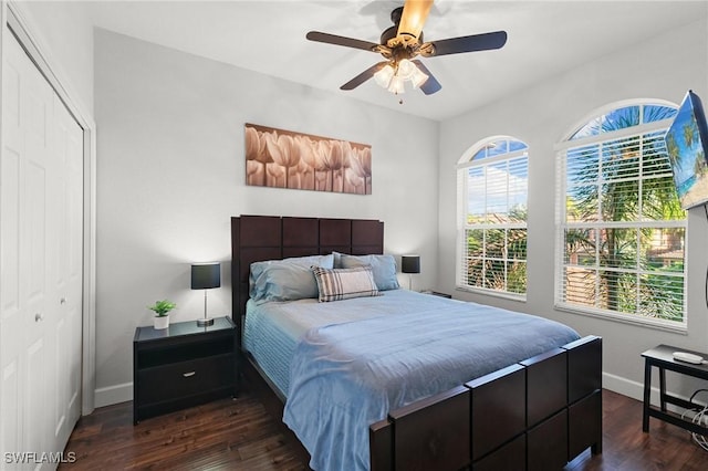 10021 Heather Ln Unit 803, Naples, FL 34119 - bedroom with a ceiling fan, baseboards, dark wood-type flooring, and a closet