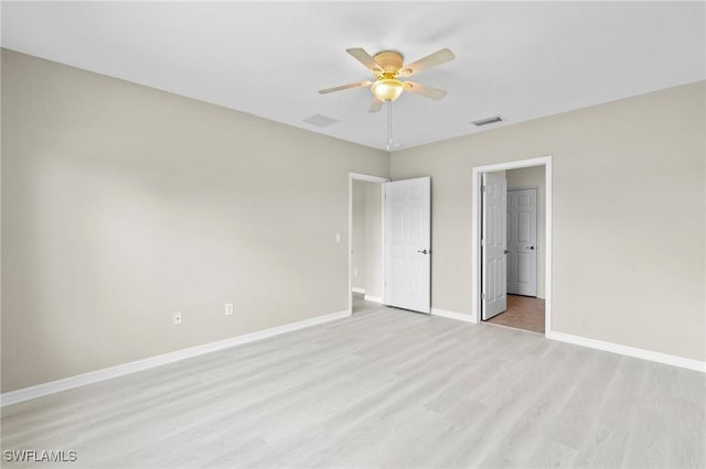 unfurnished bedroom featuring light wood-type flooring, baseboards, ceiling fan, and visible vents