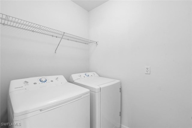 laundry room featuring washer and dryer and laundry area