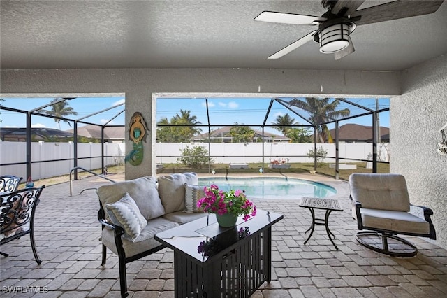 4116 SW 15th Ave, Cape Coral, FL 33914 - exterior space with a fenced in pool, a fenced backyard, a lanai, a ceiling fan, and an outdoor hangout area