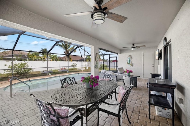 4116 SW 15th Ave, Cape Coral, FL 33914 - view of patio featuring outdoor dining space, a lanai, ceiling fan, and fence