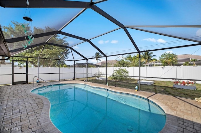 4116 SW 15th Ave, Cape Coral, FL 33914 - view of pool featuring glass enclosure, a fenced in pool, a patio area, and a fenced backyard